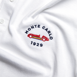 Formula 1 fans: This is a detail shot of a white polo shirt front embroidered with navy Monte Carlo name, red vintage Grand Prix car plus navy 1929.