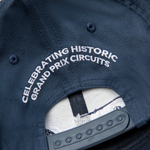 Formula 1 fans: This is a navy baseball cap back with embroidered white "celebrating historic grand prix circuits".