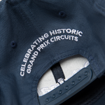 Formula 1 fans: This is a navy baseball cap back with embroidered white "celebrating historic grand prix circuits".