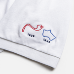 Formula 1 fans: This is a white polo embroidered with Monte Carlo and Silverstone tracks and inaugural years on the left sleeve.