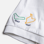 Formula 1 fans: This is a white polo embroidered with Monza and Spa tracks and inaugural years on the right sleeve.