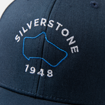 Formula 1 fans: This is a detail shot of a navy baseball cap front embroidered with blue Silverstone Grand Prix track and white Silverstone name plus white 1948.