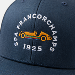 Formula 1 fans: This is a detail shot of a navy baseball cap front embroidered with orange vintage Grand Prix race car and white Spa-Francorchamps name plus white 1925.